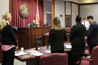 Personal injury attorneys representing an accident plaintiff in front of a judge in a court room in Lehigh Valley.
